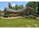 Brick house with landscaped yard and walkway at 860 Arrow Point Ln, Davidson, NC 28036