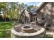 Brick patio with fire pit, grill, and seating area at 860 Arrow Point Ln, Davidson, NC 28036