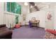 Studio room with large window, desk, and comfortable seating area at 1346 Hill Rd, Charlotte, NC 28210