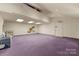 Large studio space with purple carpet and high ceilings at 1346 Hill Rd, Charlotte, NC 28210