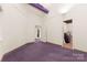Bright office space with multiple doorways and purple carpet at 1346 Hill Rd, Charlotte, NC 28210