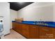 Simple kitchenette with wood cabinets and a sink at 1346 Hill Rd, Charlotte, NC 28210