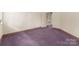 Simple office with purple carpet and a window at 1346 Hill Rd, Charlotte, NC 28210