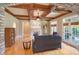 Elegant living room featuring hardwood floors, a fireplace, and large windows at 277 Tradition Dr, Mount Gilead, NC 27306