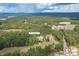 Aerial view of the property and surrounding golf course and lake at 277 Tradition Dr, Mount Gilead, NC 27306