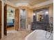 Luxurious bathroom with soaking tub, walk-in shower, and double vanity at 277 Tradition Dr, Mount Gilead, NC 27306