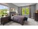 Bright bedroom with gray walls, plush bedding, and ample natural light at 15309 Ballancroft Pkwy # 34, Charlotte, NC 28277