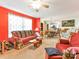 Living room with red walls, comfortable seating and dining area view at 1071 Hawks Nest Rd, York, SC 29745