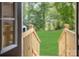 Charming backyard with wooden deck and steps leading to a grassy area at 6510 Rockwell Blvd, Charlotte, NC 28269