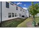 Private backyard with patio, small grass area, and white fence at 1816 Teachers House Nw Rd, Concord, NC 28027