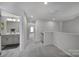 Upstairs hallway with carpet and access to bedrooms and bathrooms at 1816 Teachers House Nw Rd, Concord, NC 28027