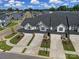 Aerial view of townhouses, showcasing their layout and street design at 1816 Teachers House Nw Rd, Concord, NC 28027