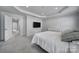 Well-lit bedroom featuring a large TV and access to hallway at 1816 Teachers House Nw Rd, Concord, NC 28027