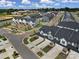 Aerial community view, showing townhouses, playground, and roads at 1816 Teachers House Nw Rd, Concord, NC 28027