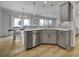 Modern kitchen with an island, stainless steel appliances, and white cabinets at 1816 Teachers House Nw Rd, Concord, NC 28027