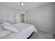 Spacious bedroom with a queen bed and access to upstairs at 1816 Teachers House Nw Rd, Concord, NC 28027