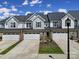 Three townhouses with two-car garages and landscaping at 1816 Teachers House Nw Rd, Concord, NC 28027