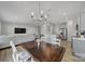Dining room features a rustic wood table and chandelier at 1816 Teachers House Nw Rd, Concord, NC 28027