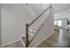 Modern staircase with white spindles and wood treads at 1816 Teachers House Nw Rd, Concord, NC 28027