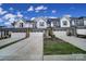 Townhouse exterior with white siding, gray roofs, and attached garages at 1816 Teachers House Nw Rd, Concord, NC 28027