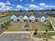 Aerial view showing townhouses, playground and parking area at 1816 Teachers House Nw Rd, Concord, NC 28027