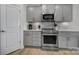 Kitchen features stainless steel appliances and gray cabinets at 1816 Teachers House Nw Rd, Concord, NC 28027