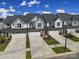 Aerial view of three townhouses with garages at 1816 Teachers House Nw Rd, Concord, NC 28027