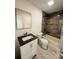 Clean bathroom featuring a bathtub, toilet, and vanity with dark countertop at 517 Green St, Rock Hill, SC 29730