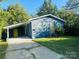 Newly painted blue house with yellow door and carport at 517 Green St, Rock Hill, SC 29730