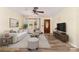 Living room with hardwood floors, neutral decor and a large TV at 214 Ruth St, Rockwell, NC 28138