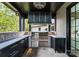 Stainless steel grill, dark cabinetry, and stone countertops at 19125 Peninsula Point Dr, Cornelius, NC 28031