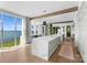 Gourmet kitchen with marble island, light cabinetry, and lake views at 19125 Peninsula Point Dr, Cornelius, NC 28031