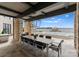 Outdoor patio with lake view and dining area at 19125 Peninsula Point Dr, Cornelius, NC 28031