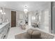 Elegant bathroom with soaking tub, vanity, and marble flooring at 19125 Peninsula Point Dr, Cornelius, NC 28031