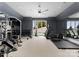 Well-equipped home gym featuring various exercise machines and weights at 19125 Peninsula Point Dr, Cornelius, NC 28031