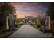Elegant home with gated entry and landscaped grounds at 19125 Peninsula Point Dr, Cornelius, NC 28031
