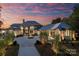 Luxury lakefront home with stone facade and fountain at 19125 Peninsula Point Dr, Cornelius, NC 28031