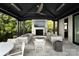 Relaxing patio with fireplace and outdoor seating at 19125 Peninsula Point Dr, Cornelius, NC 28031