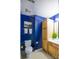 Bathroom with wooden vanity and blue walls at 1017 Silver Springs Rd, Fort Mill, SC 29715