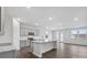 Open kitchen with island, stainless steel appliances, and hardwood floors at 2243 Carpenter Farms Dr, Lincolnton, NC 28092
