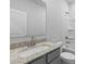Clean bathroom featuring granite countertop, gray vanity, and shower/tub combo at 2243 Carpenter Farms Dr, Lincolnton, NC 28092