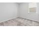 Well-lit bedroom with gray carpet and a window at 2243 Carpenter Farms Dr, Lincolnton, NC 28092