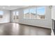 Bright living room with hardwood floors, large windows, and access to a balcony at 2243 Carpenter Farms Dr, Lincolnton, NC 28092