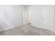 Bright bedroom with gray carpeting and access to other rooms at 2243 Carpenter Farms Dr, Lincolnton, NC 28092