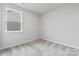Simple bedroom with gray carpet and a window at 2243 Carpenter Farms Dr, Lincolnton, NC 28092