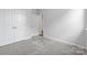 Bright bedroom with grey carpet, double doors, and an additional doorway at 2243 Carpenter Farms Dr, Lincolnton, NC 28092
