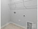 Convenient laundry room with built-in shelving and space for appliances at 2243 Carpenter Farms Dr, Lincolnton, NC 28092