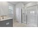 Bathroom with double vanity, granite countertop and a large walk-in shower at 2243 Carpenter Farms Dr, Lincolnton, NC 28092