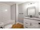 Modern bathroom with white subway tile and granite vanity at 307 S Ransom St, Gastonia, NC 28052