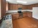 Kitchen with stainless steel appliances and wood cabinets at 1942 Stoney Point Cir, Monroe, NC 28112